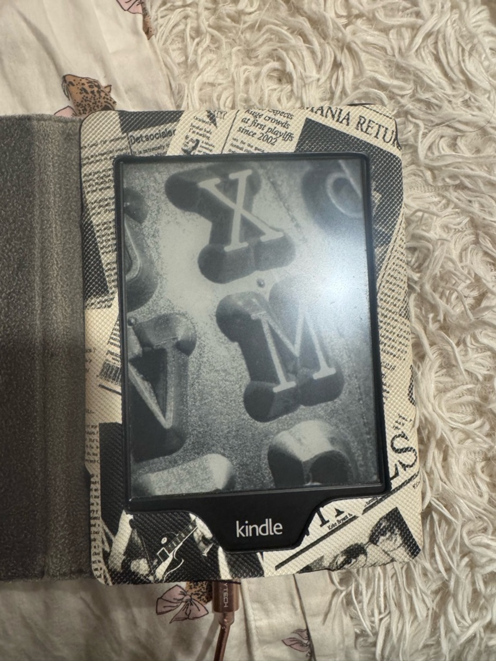Amazon Kindle E-reader with Black and White Newspaper Pattern Cover